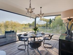 a dining room with a table and chairs and a large window at 2 Bed in Richmond oc-95005 in Gilling