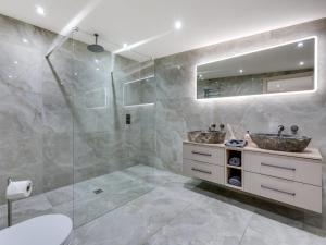 a bathroom with a shower and a sink and a mirror at 2 Bed in Richmond oc-95005 in Gilling +35 photos