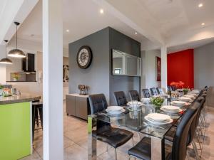 a dining room and kitchen with a long table and chairs at 9 Bed in Ipswich oc-62352 in Freston