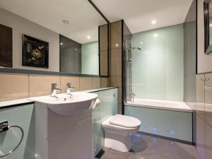 a bathroom with a sink and a toilet and a shower at 9 Bed in Ipswich oc-62352 in Freston +39 photos