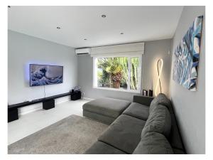 a living room with a couch and a window at Villa Infinity Exclusive in Tías