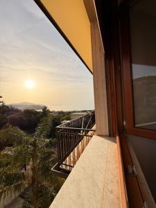 a balcony with a view of the sunset at Supramonte Guesthouse in Agropoli