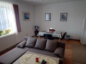 a living room with a couch and a table at Zukalka 2KK - 1 in Ostrava