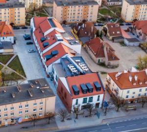 an aerial view of a town with houses and buildings at Apartamenty Odrodzenia 11 in Szczytno