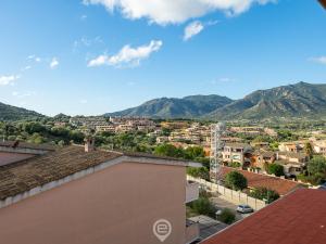 a view of a city from the roof of a house at Estay - Maria's Wonderful Retreat in Villasimius +21 photos