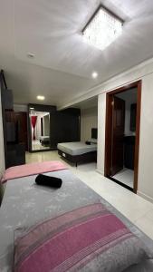 a bedroom with a large bed with a ceiling at Apartamento em Pomerode - 205 in Pomerode