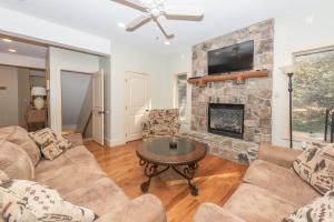 a living room with a couch and a fireplace at Mystic Haven by Railey Vacations in Oakland