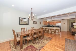 a dining room and kitchen with a table and chairs at Mystic Haven by Railey Vacations in Oakland