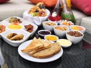 a table topped with different types of breakfast foods at Hazelton in Islamabad