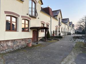 a row of houses on a street at Agroturystyka Maya in Gorzyca