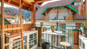 a balcony with a view of a house at Le Birdie NI105 - ST2 in Giez
