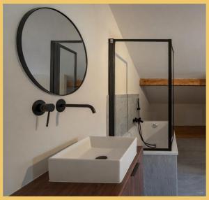 a bathroom with a white sink and a mirror at Le Balcon du Mont-BIanc I Duplex I Combloux in Combloux +27 photos