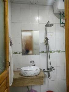 a bathroom with a sink and a mirror at SUN Homestay sa pa in Sapa +38 photos