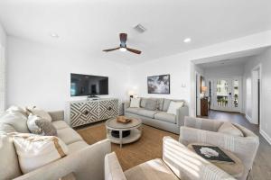 a living room with a couch and a table at Doc's Folly in Gulf Shores