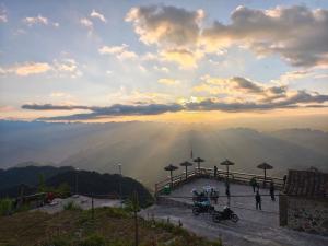 a group of people standing on top of a mountain at Easy Ha Giang in Làng Lap