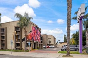 a building with a painting on the side of it at Hotel Milagro in Chula Vista