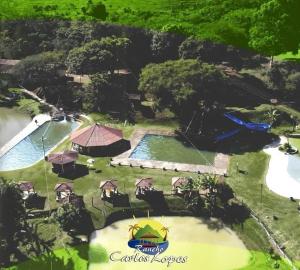 an aerial view of a resort with a swimming pool at Glamping in Lavrinhas