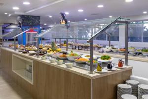 a buffet line with a lot of food on it at Hotel Cartagena Plaza in Cartagena de Indias