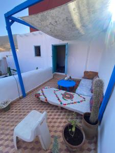 a room with a tent with a couch and a table at casa tradicional marroqui in Sidi Ifni