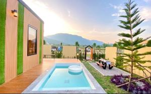 a swimming pool on the roof of a house at Nordic pool villa huahin6 in HHQ