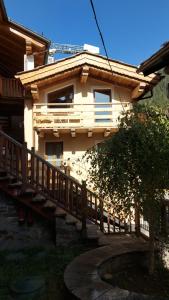 a house with a staircase leading up to it at CAV MES VALLEES La Thuile in La Thuile