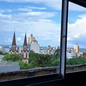 a view of a city from a window at Hotel Posadas in Posadas