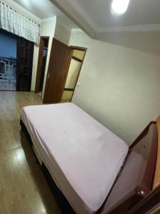 a large bed in a room with at Predinho do Guaratuba in Guaratuba
