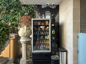 a refrigerator full of food and drinks in a building at Résidence P&C Studio calme & cosy proche Paris - Neuilly-sur-Marne in Neuilly-sur-Marne