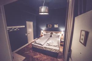 Llit o llits en una habitació de Hotel Luis