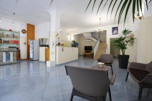 a large room with a kitchen and a living room at Hotel da ettore in Porto Cesareo