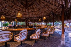 a bar in a resort with chairs around it at Hotel Irotama Lago in Santa Marta +85 photos