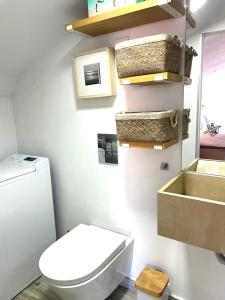 a bathroom with a toilet and a sink at Don Sebastiao in Sesimbra +13 photos
