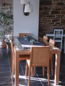 a dining room table with chairs and a table and a table and chairsktop at La lune en bulles in Presseux