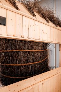 a pile of nets on top of a wooden wall at Stay4U Apartments Belle View in Szklarska Poręba