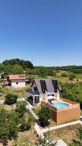 an aerial view of a house with a swimming pool at Panorama Kosmaj in Sopot