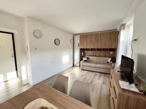 a living room with a couch and a table at Mono Giudici in Clusone