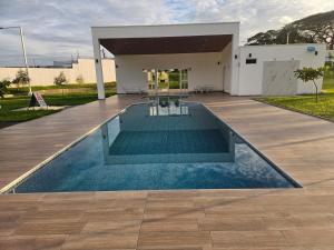 a swimming pool in front of a house at Casa Márquez in San Miguel