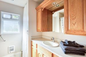 a bathroom with a sink and a mirror at La Maison - Elegant 2BR Escape - Free Breakfast! in Albany +25 photos