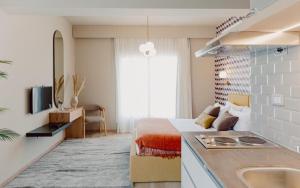 a bedroom with a bed and a sink in a room at BirdNest at Sheikh Zayed in Sheikh Zayed