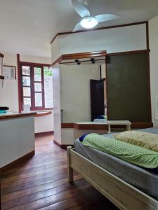 a bedroom with a bed and a chalkboard on the wall at Casa Country Niterói in Niterói