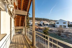 a view from the porch of a house with a fence at Check-In by BeOne RW-N in Rottweil
