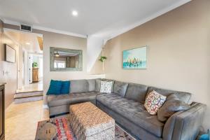 a living room with a couch and a table at Sunkissed Oasis in Navarre