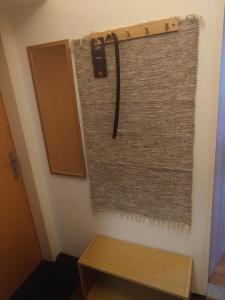 a towel hanging on a wall next to a table at Zukalka 2KK - 2 in Ostrava