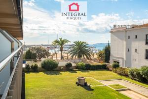 a view from the balcony of a house with a yard at Why Not Apartment Palamós in Palamós