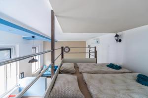 a bedroom with two beds on a balcony at D53 Apartments in Budapest