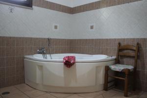 a bathroom with a tub with a flower on it at Casa Radiosa in Sora
