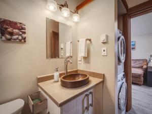 a bathroom with a sink and a toilet at Going Coastal ABC - Oceanfront - Pet Friendly in Port Renfrew +38 photos