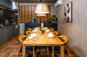 a dining room table with chairs and a tableablish at Kawaramachi Grande Joy in Takamatsu