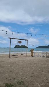 a tent on the beach with a string of lights at Safary Tour in Ban Ta Kun +7 photos