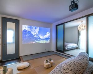 a bedroom with a view of a mountain at Kawaramachi Grande Joy in Takamatsu